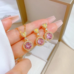Pink heart jewelry set with gold pendant necklace and stud earrings in display box