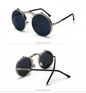 Detail of steampunk flip-up sunglasses with gold metal frame and spiral textured temples