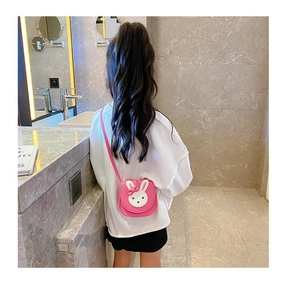 Pink mini crossbody bag for girls featuring a cute rabbit motif and delicate bow details