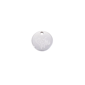 Detailed view of silver stainless steel round pendant with engraved floral pattern