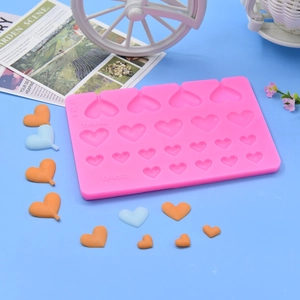 Pink heart-shaped silicone mold with 16 cavities for DIY chocolate and cake decoration