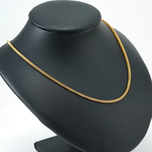 Classic 18K gold plated stainless steel mesh chain necklace displayed on a black bust
