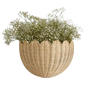 Detail of hand-woven wicker wall basket with scalloped edges and baby's breath flowers