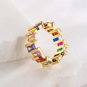 18K gold plated copper ring with colorful rectangular zircon stones on marble base