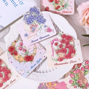 Artistic pastel floral greeting cards with Sweet Dreams text on a white shell plate