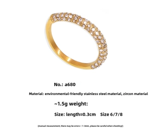 Detail view of gold PVD plated stainless steel ring with micro-paved cubic zirconia