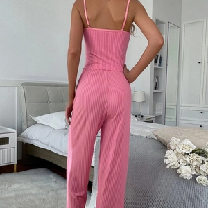 Pink ribbed two-piece pajama set featuring camisole top and wide-leg lounge pants