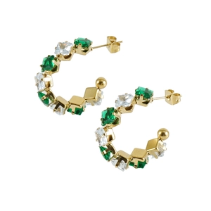 Detailed close-up of gold hoop earrings with alternating green and clear square zircons