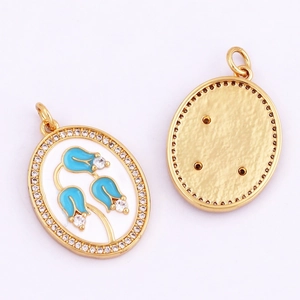 Detailed macro view showing blue enamel tulip pendants with zircon accents on gold plated brass