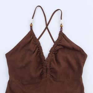 Brown halter neck linen blend dress with beaded strap detail and deep V-neck design