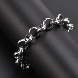 Detailed close-up of a silver stainless steel 12mm round link chain bracelet on a black display