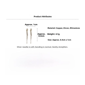 Detail view of long tassel knot heart earrings with zirconia inlays and silver needles
