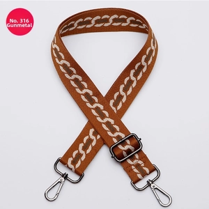 Adjustable brown geometric jacquard purse strap with gunmetal lobster clasps