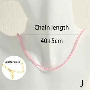 Detail of pink beaded necklace showing the adjustable lobster clasp and chain length