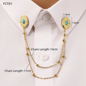Detail of vintage gold collar pin with turquoise stone and double beaded chains