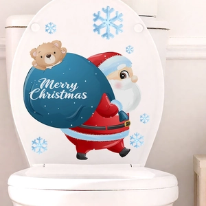 Macro view of Christmas Santa and snowflake self-adhesive stickers on a toilet lid
