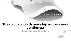 Close-up of white cotton baseball cap brim featuring three silver metal ring decorations