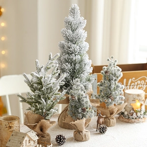 Mini tabletop snowy Christmas trees with burlap base and natural pinecones decor