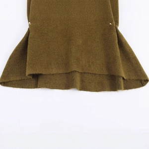 Asymmetric knitted top with trumpet cuffs and gold button details in olive green color