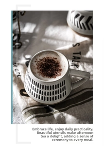 Detailed top view of a Nordic ceramic mug featuring hand-painted dots on a linen tablecloth