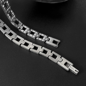 Detailed comparison of polished and brushed silver finish stainless steel chain bracelets