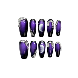 Faux ongles faits main œil de chat violet avec dégradé noir et strass brillants