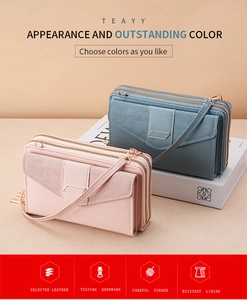 Detail of pink and blue PU leather phone purses with dual zipper and adjustable shoulder straps