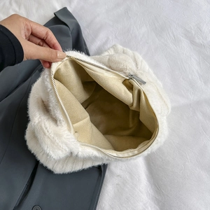 Minimalist white fuzzy faux fur tote bag showing spacious interior with metal zipper