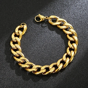 Polished gold 304 stainless steel Cuban link bracelet for men on textured black background