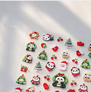 Macro detail of 3D embossed Christmas nail stickers with Santa and festive patterns