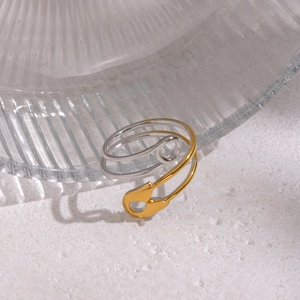Unique geometric paperclip safety pin ring in gold and silver tones with an open design