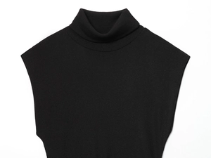 Detailed texture of black sleeveless turtleneck knit dress with ribbed knit pattern