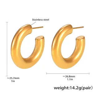 Macro detail of thick gold PVD plated stainless steel C-hoop earrings with 25mm dimensions