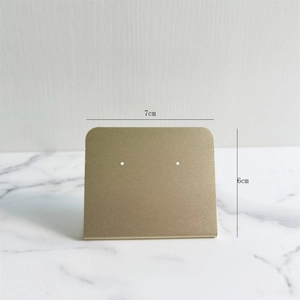 Detail shot of matte gold earring display stand with 7cm width and 6cm height dimensions