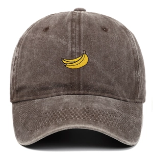 Close-up of embroidered banana pattern on vintage washed dark brown cotton baseball cap