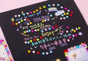 Close-up of colorful 3D crystal heart and flower stickers for DIY creative projects