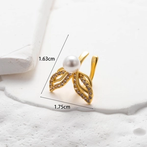Macro shot of gold leaf ear cuff with micro-pave zircons and pearl, size 1.63x1.75cm