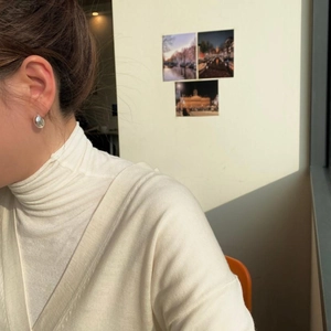 Minimalist 925 sterling silver ball stud earrings shown on model for a modern look