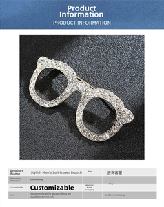 Detail of silver glasses brooch with sparkling rhinestones on textured background