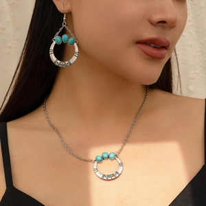 Detail of vintage silver necklace with turquoise beads worn on neck for boho look