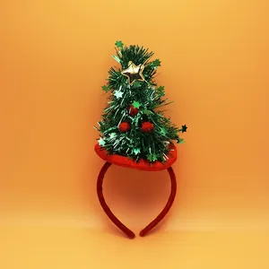 Sparkly Christmas tree headband with golden star and festive red pompoms for holiday parties