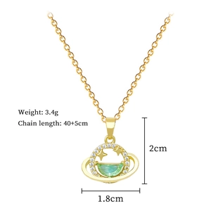 Macro detail of star planet gold necklace showing 3.4g weight and 40+5cm chain size