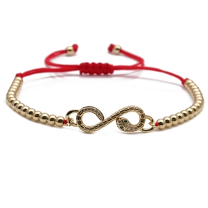 Adjustable red rope bracelet with gold infinity snake charm and zircon stones