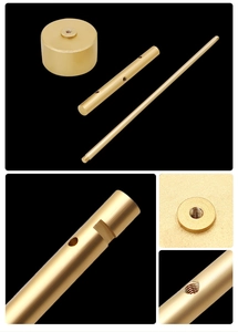 Macro details of golden T-bar earring stand components with polished brass finish