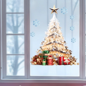 Detail of Christmas tree and snowflake static window clings on white window frames