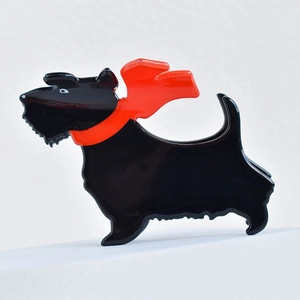 Black Scottish Terrier hair claw clip with a red scarf detail in high-gloss finish