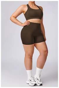 Detail of dark brown high-waisted yoga set with racerback bra and elastic fitness shorts