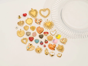 Detailed collection of 18k gold plated stainless steel heart and sun charms for DIY jewelry