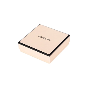 Elegant square light pink jewelry box with black trim and JEWELRY text on white background