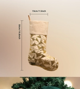 Detail showing 50cm beige Christmas stocking with gold geometric patterns and hanging loop